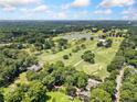 Scenic aerial shot showcases lush green landscape with nearby golf course and blue sky at 2830 Alston Drive Se Dr, Atlanta, GA 30317
