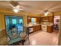 Functional kitchen with wooden cabinets, and a view into the connected dining area at 4402 Autumn Hill Drive, Stone Mountain, GA 30083
