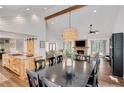 Open dining area featuring a large table, stylish chandelier, and seamless flow to the living spaces at 1519 Biddle Ct, Dunwoody, GA 30338