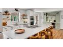 Modern kitchen with a large island, stainless steel appliances, and custom cabinetry at 1519 Biddle Ct, Dunwoody, GA 30338