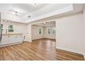 Open living room with hardwood floors, vaulted ceilings, and lots of natural light at 2155 S Deshon S Rd, Lithonia, GA 30058