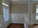 Bright entryway featuring decorative trim, wood floors, and natural light from the front door at 735 Briarhurst Ct, Lawrenceville, GA 30046