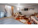 Comfortable living room showcasing stylish floors, staircase and vintage floral-patterned furniture at 3301 Henderson Mill Rd # X4, Atlanta, GA 30341