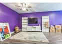 Cozy living room featuring modern lighting, built-in shelves, and a stylish accent wall at 7240 Kings Cv # 11, Austell, GA 30168