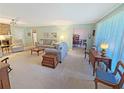 Inviting living room with natural light, neutral walls, fireplace, and open access to the kitchen at 2251 Stag Run Run, Suwanee, GA 30024