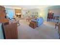 Spacious living room featuring a brick fireplace, neutral walls, and classic furnishings at 2251 Stag Run Run, Suwanee, GA 30024