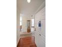 A bright entryway boasts hardwood floors, leading to a charming display cabinet and an inviting interior at 1800 Clairmont Lk # 326, Decatur, GA 30033