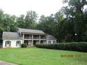 Two-story home with a covered porch, shutters, and well-maintained landscaping at 5523 Bahia Mar Cir, Stone Mountain, GA 30087