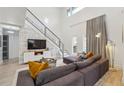 Bright living room with a soaring ceiling, comfortable seating, modern design, and natural light at 1740 S Gordon Sw St, Atlanta, GA 30310