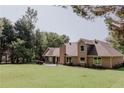 Expansive backyard with a brick house, perfect for outdoor activities and entertaining at 180 Jay Trl, Fayetteville, GA 30215