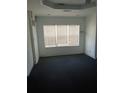 Empty bedroom featuring a textured brick wall, carpeted floors, and natural light at 3072 Will Rogers Se Pl, Atlanta, GA 30316