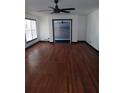Bright living room featuring hardwood floors, white walls and large windows at 3072 Will Rogers Se Pl, Atlanta, GA 30316