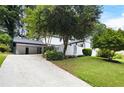 Lovely home with well-maintained lawn, mature trees, and a two car garage at 464 Rockborough Ter, Stone Mountain, GA 30083