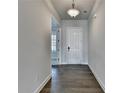 Bright hallway with gray walls and hardwood floors, offering an inviting entrance to the home at 3695 Andover St, Cumming, GA 30028