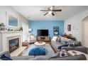 Cozy living room with fireplace and a blue accent wall at 971 Brownstone Ln # 18, Marietta, GA 30008