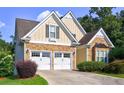 Charming home featuring a two-car garage and stone accents at 490 Grand Teton Cir, Fayetteville, GA 30215