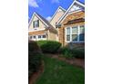 Close up view of this charming home with stone accents and manicured landscaping at 490 Grand Teton Cir, Fayetteville, GA 30215