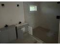 Bathroom under construction with dual vanity, shower and white walls at 7 Charleston Se Ave, Atlanta, GA 30315