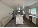 Spacious kitchen featuring new white cabinetry, a center island and modern design under construction at 7 Charleston Se Ave, Atlanta, GA 30315