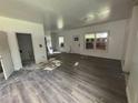 Living room under construction features wood look flooring and natural light at 7 Charleston Se Ave, Atlanta, GA 30315