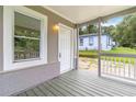 Inviting covered front porch with white railings and space for outdoor seating at 1441 Monteel Nw Dr, Atlanta, GA 30318