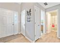 Bright entryway featuring hardwood floors and a view of the bathroom at 137 Hidden Lake Cir, Canton, GA 30114