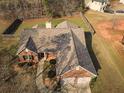 Charming single-story brick home featuring a well-maintained roof, fenced backyard, and serene surroundings at 1109 Norsworthy Ml, Hampton, GA 30228