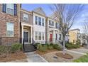 Attractive townhouse showing manicured front yard and inviting front entrance at 1292 Park Bench Pl, Mableton, GA 30126