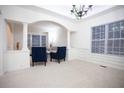 Bright living room with white trim and arched doorways to other rooms at 6674 Mimosa Cir, Tucker, GA 30084