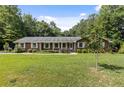 Lovely one-story brick home featuring a well-maintained lawn and traditional design at 1051 Rock Springs Rd, Lawrenceville, GA 30043