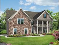 Charming two-story home with a stone facade, a front porch, and a well-manicured lawn at 5985 Old Timber Trl # 7, Douglasville, GA 30135