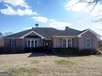 Brick ranch house with attached garage and large yard at 0 Hawkins Academy Rd, Social Circle, GA 30025