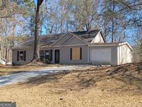 Traditional single-story home with a driveway and attached one-car garage at 110 Peridot Pl, South Fulton, GA 30349