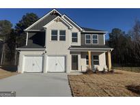 Charming two-story home with a two car garage and a beautifully contrasting color scheme at 342 Orwell Dr # 95, Social Circle, GA 30025