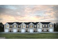 Charming townhome complex featuring gray siding, black shutters and doors, and well-manicured lawn at 253 Ivey Ter # 48, Temple, GA 30179