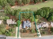 Aerial view of house and surrounding golf course at 716 Euel Dr, Mcdonough, GA 30252