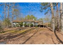 Ranch home with deck, nestled in a wooded setting at 785 Seabolt Rd, Locust Grove, GA 30248