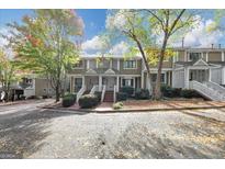 Charming townhome with well-maintained landscaping and a welcoming entrance at 6 Alston Ne Pl, Atlanta, GA 30324