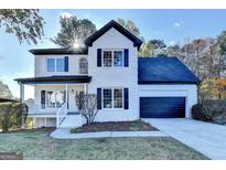 Beautiful two-story brick home with a covered porch and a two-car garage at 1285 Cedar Brook Dr, Lawrenceville, GA 30043