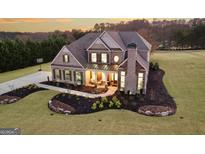 Luxury home on large lot with landscaped yard and driveway at 115 Haddonstone Dr, Fayetteville, GA 30215