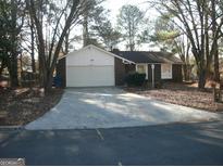 Brick ranch home with attached garage and driveway at 295 Adena W Ln, South Fulton, GA 30349