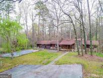 Ranch home with a pool and wooded lot at 2497 Old Jackson Rd, Locust Grove, GA 30248