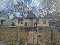 Yellow single-story house with steps leading to front porch at 255 Stafford Nw St, Atlanta, GA 30314