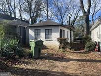 Small cottage with a grassy backyard at 1093 Smith Sw St, Atlanta, GA 30310