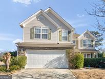 Two-story house with stone accents and a two-car garage at 1598 Thornwick Trce, Stockbridge, GA 30281