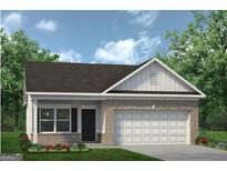 Brick ranch home with a two-car garage and landscaped front yard at 1479 Trellis Court (Lot 3), Hampton, GA 30228