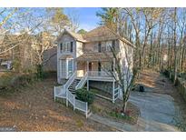 Charming two-story home featuring a welcoming front porch and well-maintained landscaping on a generous lot at 2618 Windage Sw Dr, Marietta, GA 30008