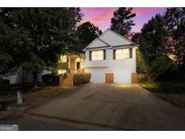 Two-story house with attached garage and front yard at 375 Sapphire Bnd, Riverdale, GA 30296