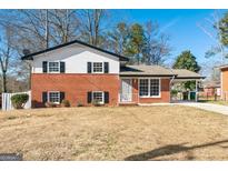 Brick ranch house with attached carport and a spacious front yard at 6559 Allatoona Rd # 19, Morrow, GA 30260