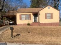 Ranch style home with carport and mature trees at 2276 Hillside Ave, Decatur, GA 30032